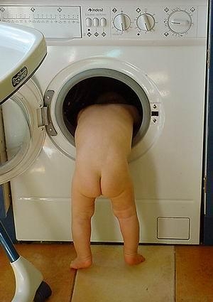 naked-baby-in-a-laundry
